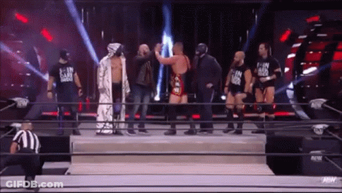 Wrestlers Standing In Ring GIF