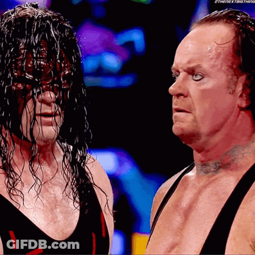 Wrestlers Standing Next To Each Other GIF