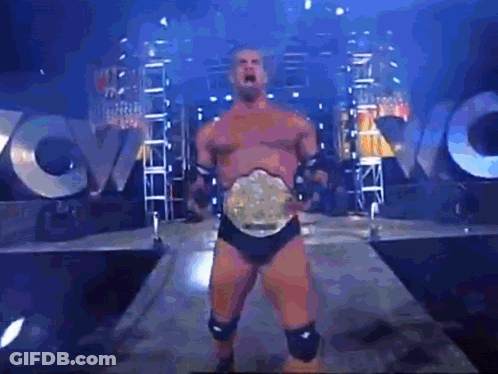 Wrestling Man With Belt In Front Of WVC Sign GIF