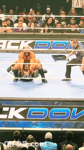 Wrestling Match In Front Of Faith Sign GIF