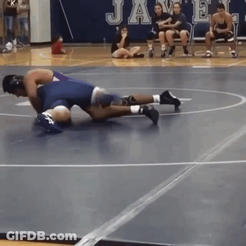Wrestling Match In Front Of Javelin Sign GIF