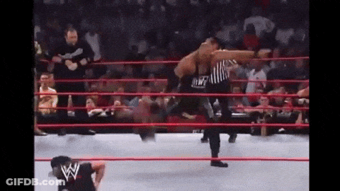 Wrestling Match In Ring With Referee And Crowd GIF