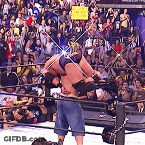 Wrestling Ring Man Holding We Love You Sign GIF