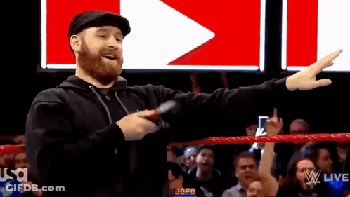 Wrestling Ring Man Pointing To Crowd With Microphone GIF