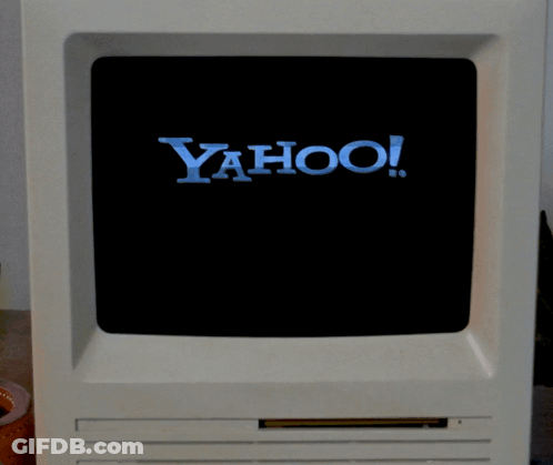 Yahoo Logo On Computer Screen With Hand Pointing GIF
