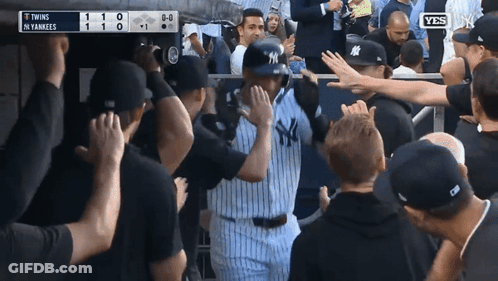 Yankees Baseball Player Surrounded By Fans GIF