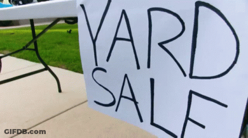 Yard Sale Sign On Table Outside GIF