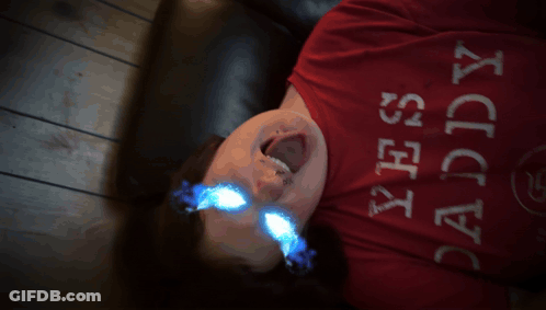 Yawning Cat Laying On Couch GIF