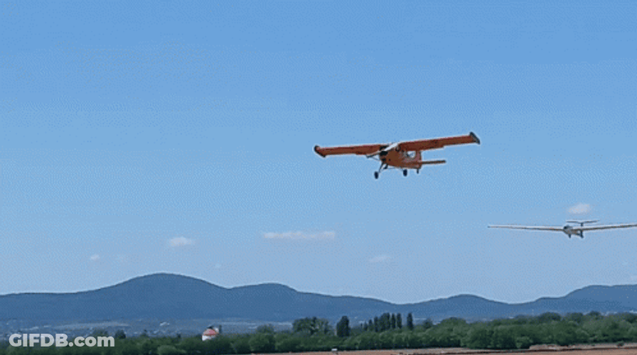 Yellow Airplane Passing By GIF