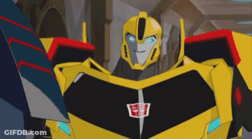 Yellow And Black Robot With Blue Eyes And Transformer Logo GIF