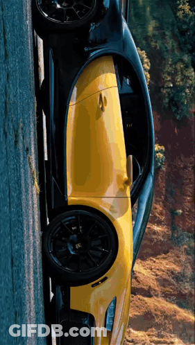 Yellow And Black Sports Car Parked On Road GIF