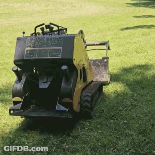 Yellow And Black Tractor Parked GIF
