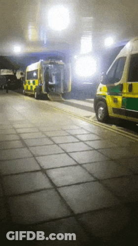 Yellow And Green Ambulance Parked GIF