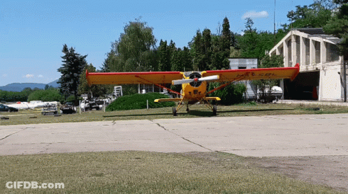 Yellow And Red Airplane With L-AE-SOL On Wing GIF
