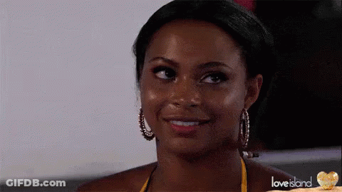 Yellow Bikini Woman Smiling At Camera With Hoop Earrings GIF