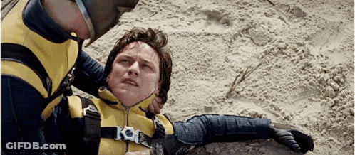 Yellow Black Suited Man Laying Helmet Man Watching GIF