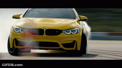 Yellow BMW Driving Down Track GIF