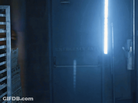 Yellow Bunny With Blue Bow Tie In Dark Room GIF