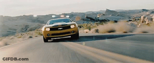 Yellow Car Driving Down Desert Road GIF