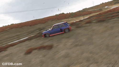 Yellow Car Driving Down Road With Grassy Field GIF