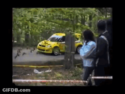 Yellow Car Driving Down Road Woman Taking Picture GIF