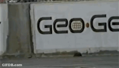Yellow Car Driving Past Go Sign GIF