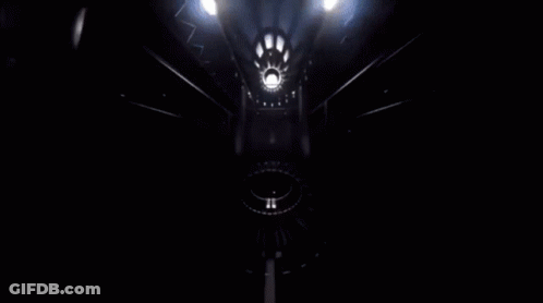 Yellow Car Driving Through Tunnel In Dark Room GIF