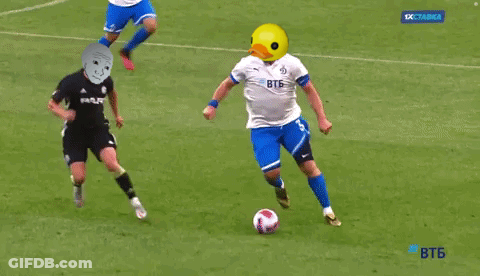 Yellow Duck Head Soccer Player Kicking Ball GIF