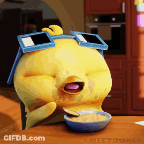 Yellow Duck Wearing Sunglasses Eating Cereal GIF
