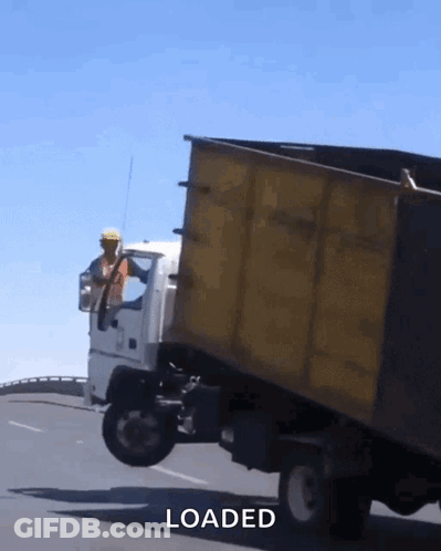 Yellow Dump Truck Being Loaded GIF