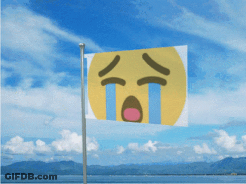 Yellow Flag Flying In Wind Near Ocean GIF