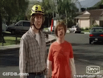 Yellow Helmet Man Next To Red Shirt Man GIF