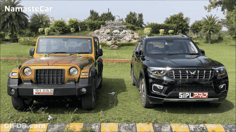 Yellow Jeep And Black SUV Side By Side GIF