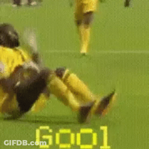 Yellow Jersey Soccer Player Laying On Ground GIF