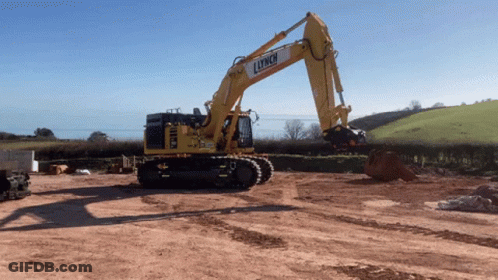 Yellow Lynch Excavator In Dirt Field GIF