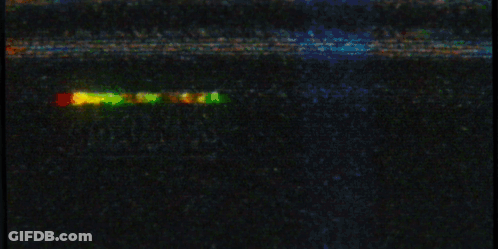 Yellow Marvel Sign Lit Up In Dark GIF