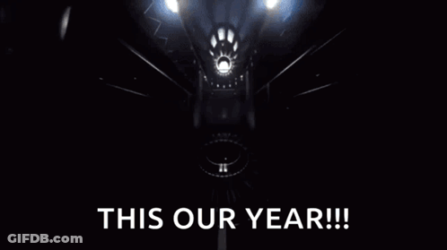 Yellow Object Flying Through Dark Room Saying This Our Year GIF