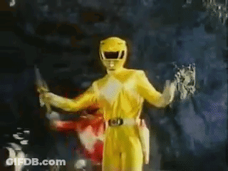 Yellow Power Ranger Holding Knife And Sword GIF