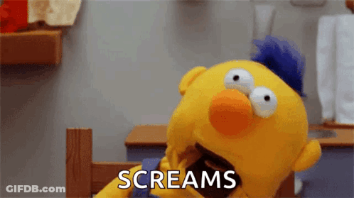 Yellow Puppet With Blue Mohawk Screaming GIF