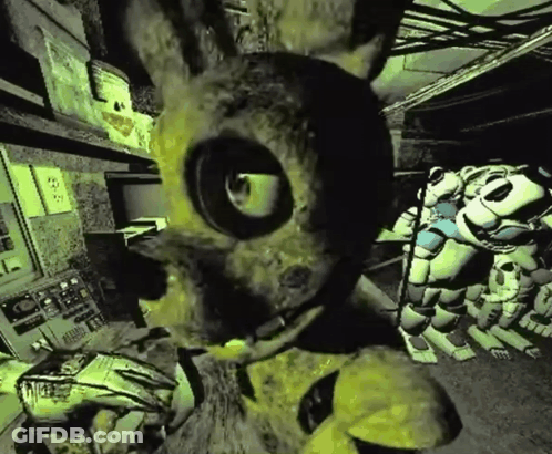 Yellow Rabbit With Large Eye In Dark Room GIF