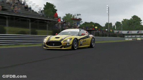 Yellow Race Car Number 23 Driving On Track GIF
