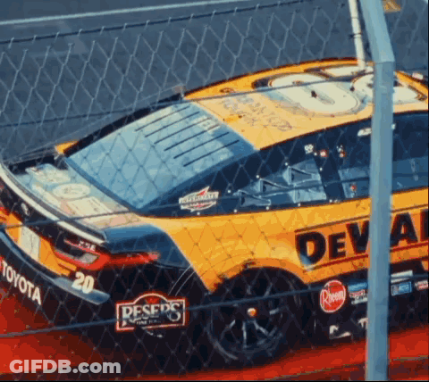 Yellow Race Car With Deval On Side GIF