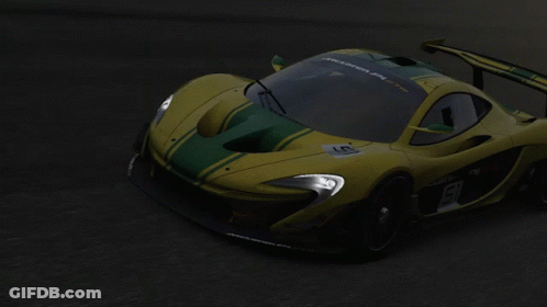 Yellow Race Car With Green Stripes GIF