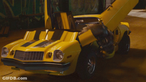 Yellow Robot With Blue Eyes In Building GIF