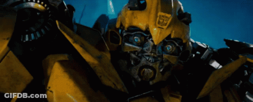 Yellow Robot With Transformers Logo GIF