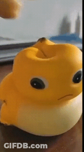 Yellow Rubber Duck With Banana In Mouth GIF