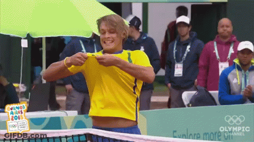 Yellow Shirt Man Selfie Green Umbrella Olympic Banner GIF