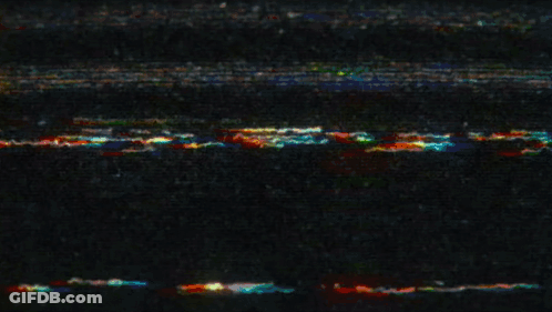 Yellow Sign Saying Marvel On Dark Background GIF