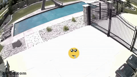 Yellow Smiley Face In Front Of Fence And Pool GIF
