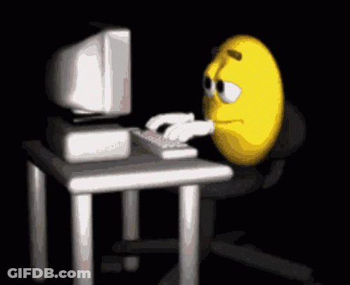 Yellow Smiley Face Typing On Keyboard GIF